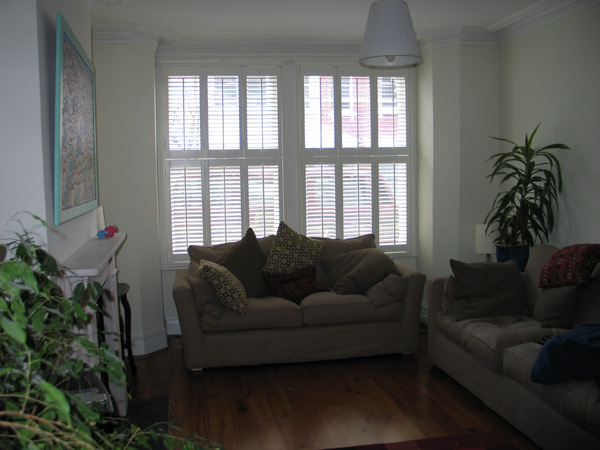 Tier-on-tier plantation shutters 47mm in wood, these shutters open LLL and RRR to the outside of the room