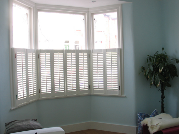 Cafe style plantation shutters in MDF with 47mm louvres