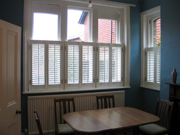 Cafe height plantation shutters 47mm louvres MDF