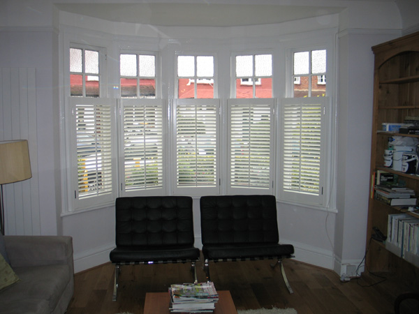 Silk white plantation shutters in wood with 47mm louvres