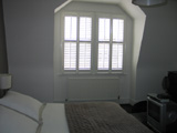 Plantation shutters installed in Highgate full height with midrail