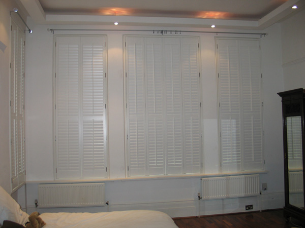 MDF plantation shutters with 63mm louvres in silk white
