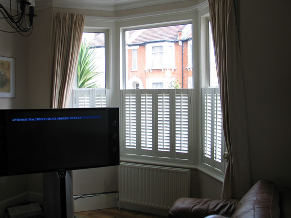 Cafe height plantation shutters, silk white MDF with 47mm louvres