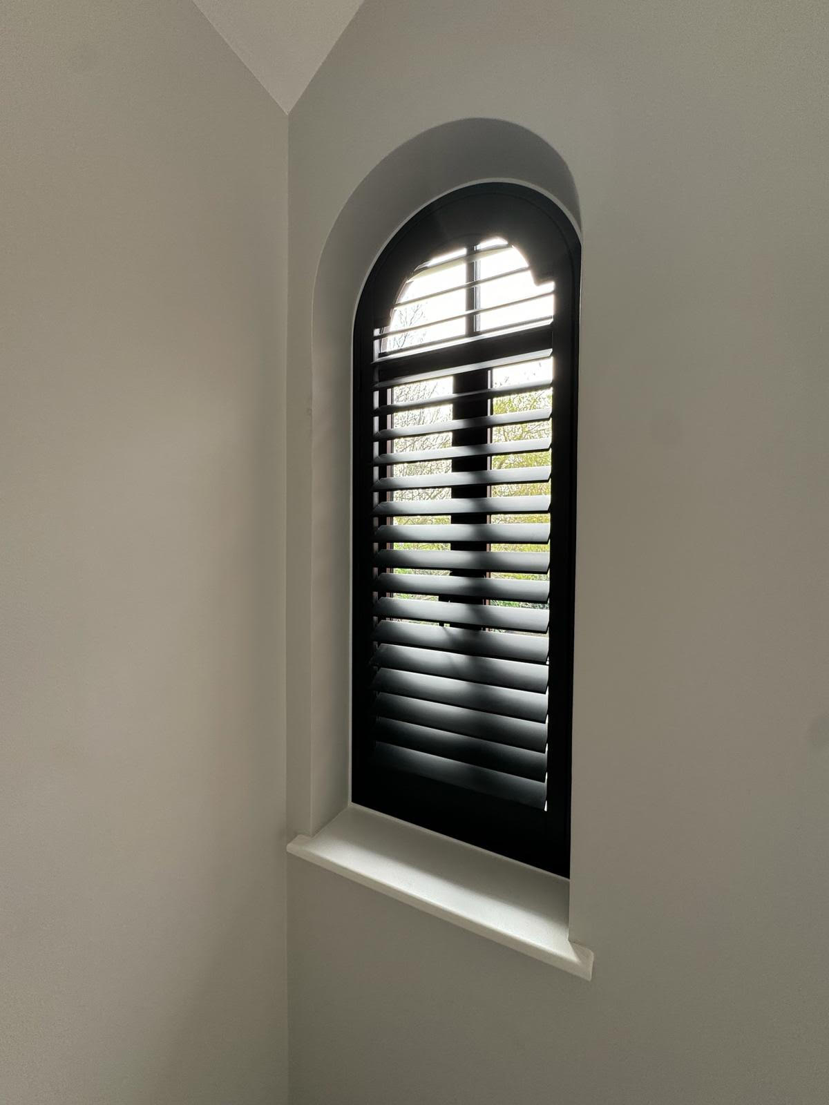 arched plantation shutter in Stained Wood fitted in Central London