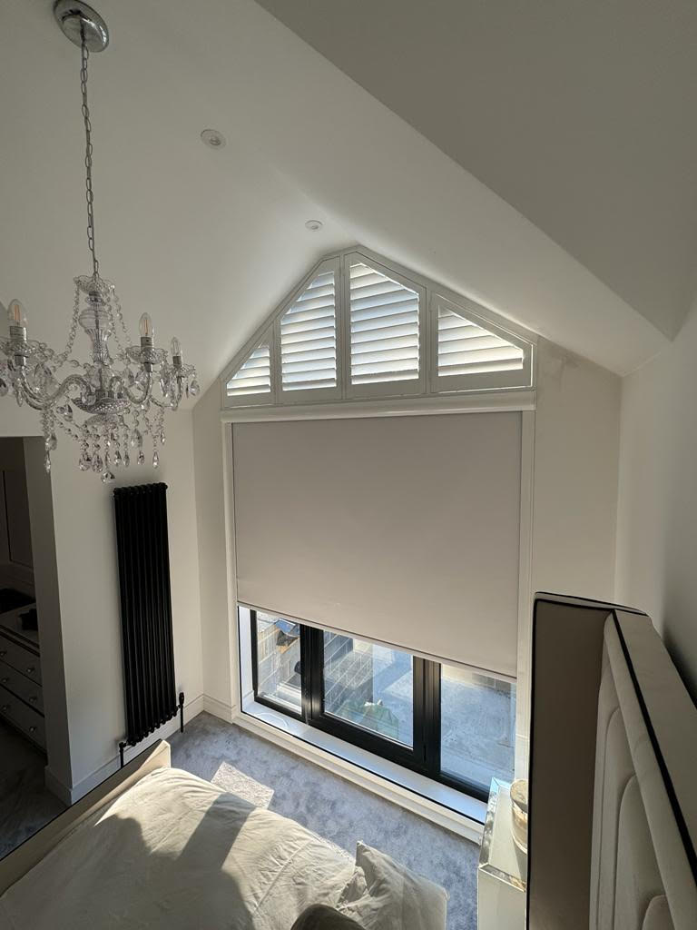 triangular wooden shutters above a cassetted blackout roller blind in Central London